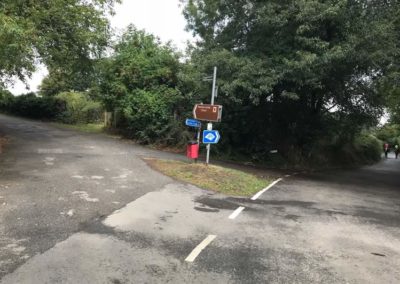 The official route turns left up hill, but an alternative would be to turn right onto Redhill Road.