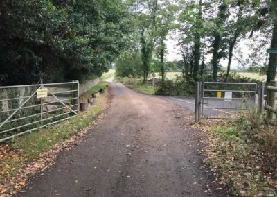The bridleway runs into the tarmacked road