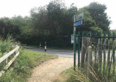 At the end of the cycle path turn right to join Afton Road/A3055