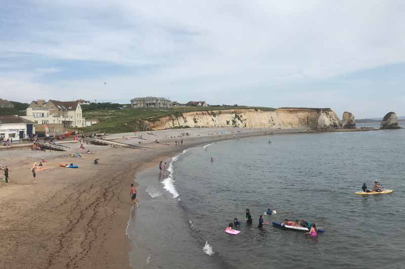 Enjoy the beach and the beautiful cliffs at Freshwater Bay